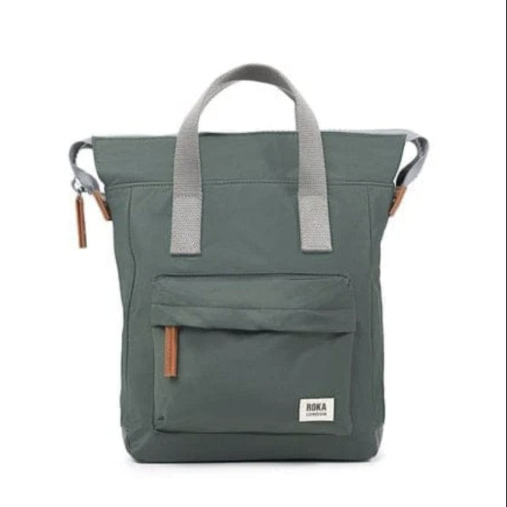 A thyme coloured bag with grey handles and brown leather accents, featuring a front pocket.