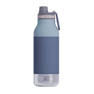 A reusable water bottle with a matte slate blue body, a grey screw cap, a grey carrying loop, and a clear lower section. The word 'WATER' is printed on the clear section.