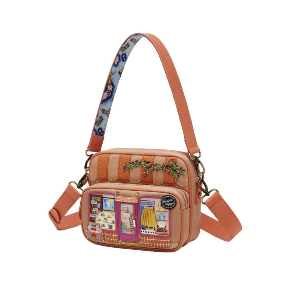 Crossbody bag with colorful design on a white background