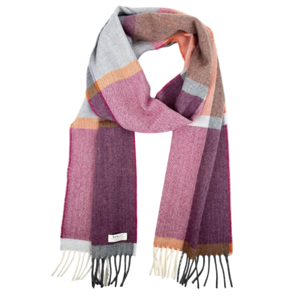A multicolor plaid scarf with a herringbone texture, featuring shades of pink, purple, gray, orange, and brown, finished with cream and black fringe. 