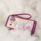 Pink wallet with hot air balloon design on a fluffy white background