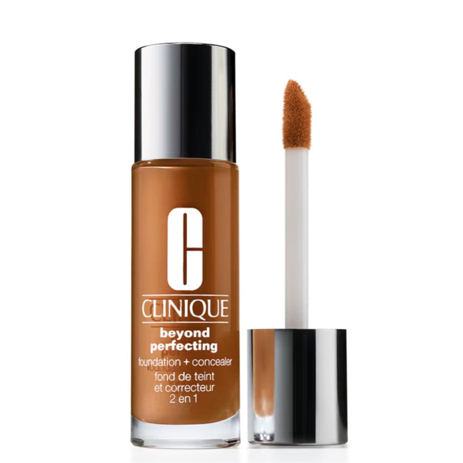 Clinique foundation and concealer with applicator on a white background. Shade Amber