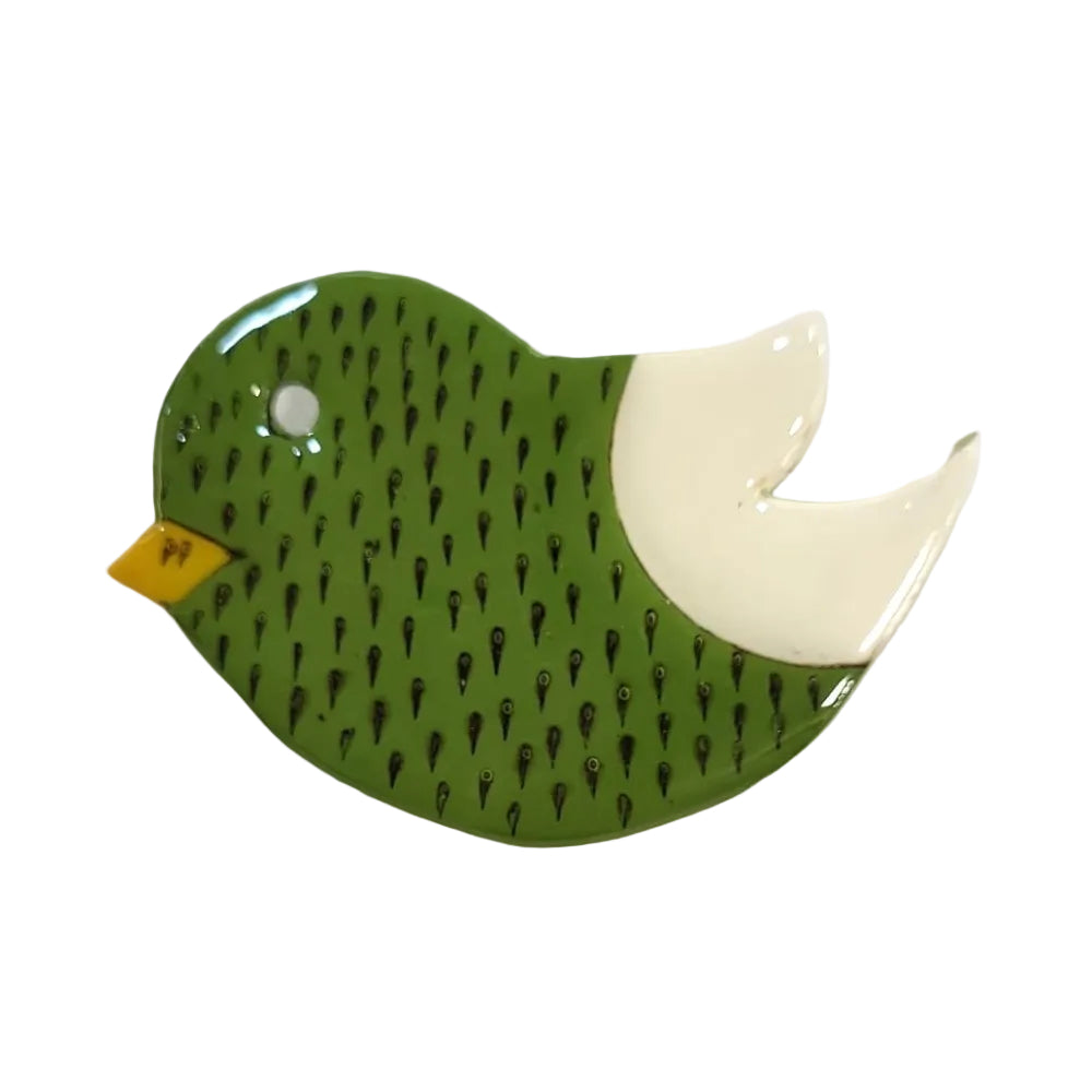 Green bird-shaped brooch pin on a white background