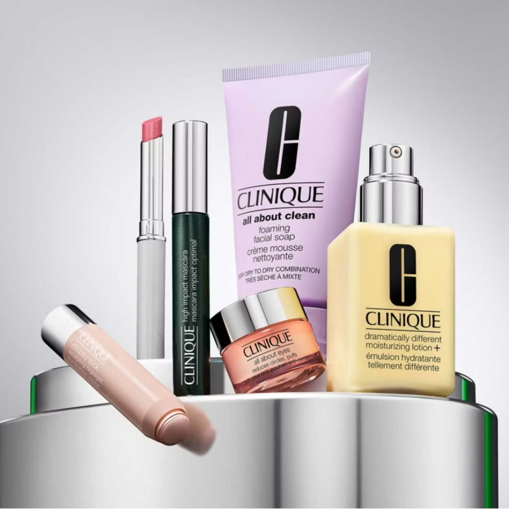 Collection of Clinique skincare products on a gray background