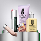 Collection of Clinique skincare products on a gray background