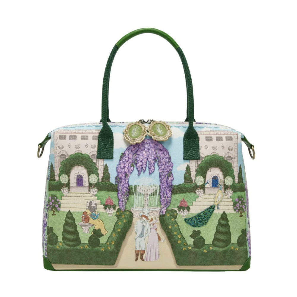 Handbag with garden scene design on a white background