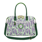 Floral patterned handbag with green accents on a white background