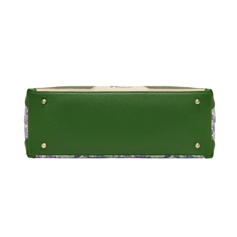 Green handbag with floral pattern on a white background