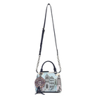 A small structured handbag with a navy leather top handle and shoulder strap, featuring a light blue and white architectural illustration print and a circular hanging charm, shown on a plain white background.