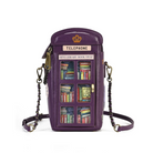 A purple faux-leather crossbody phone bag designed to look like a telephone booth, featuring a gold crown logo, a 'TELEPHONE' sign, and a 'MINI LIBRARY BOOK SWAP' label. The front has six illustrated bookshelves filled with colorful books, and the bag is shown with its black chain strap on a white background.