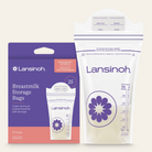 Lansinoh Breastmilk Storage Bags shown with their retail packaging on a light cream background. The set includes a white and purple 25-piece bag with an attached pump adapter and a matching retail box.