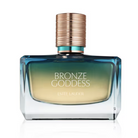 Estee Lauder Bronze Goddess Eau de Toilette bottle, featuring a square glass container with a blue-to-gold gradient, a metallic bronze cap, and white lettering on a clean white background.