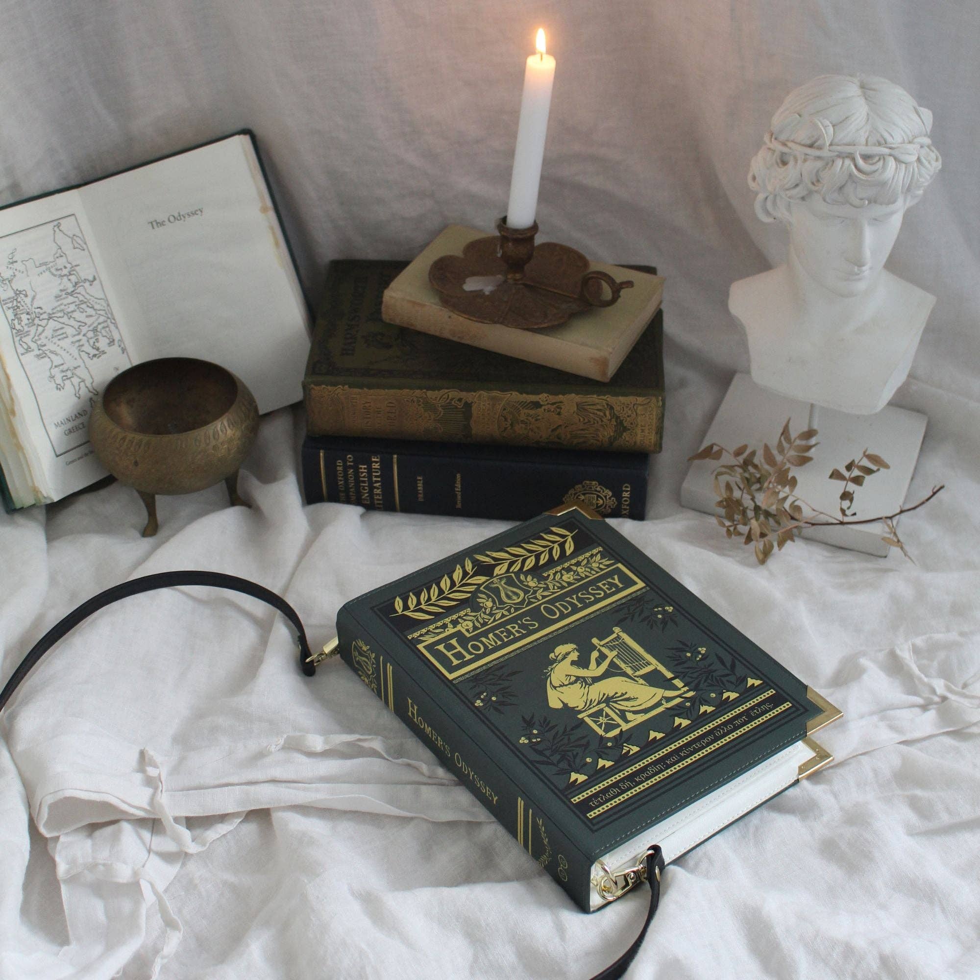 Book-shaped bag with 'Homer's Odyssey' design on a white background