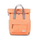 Orange backpack with gray straps on a white background