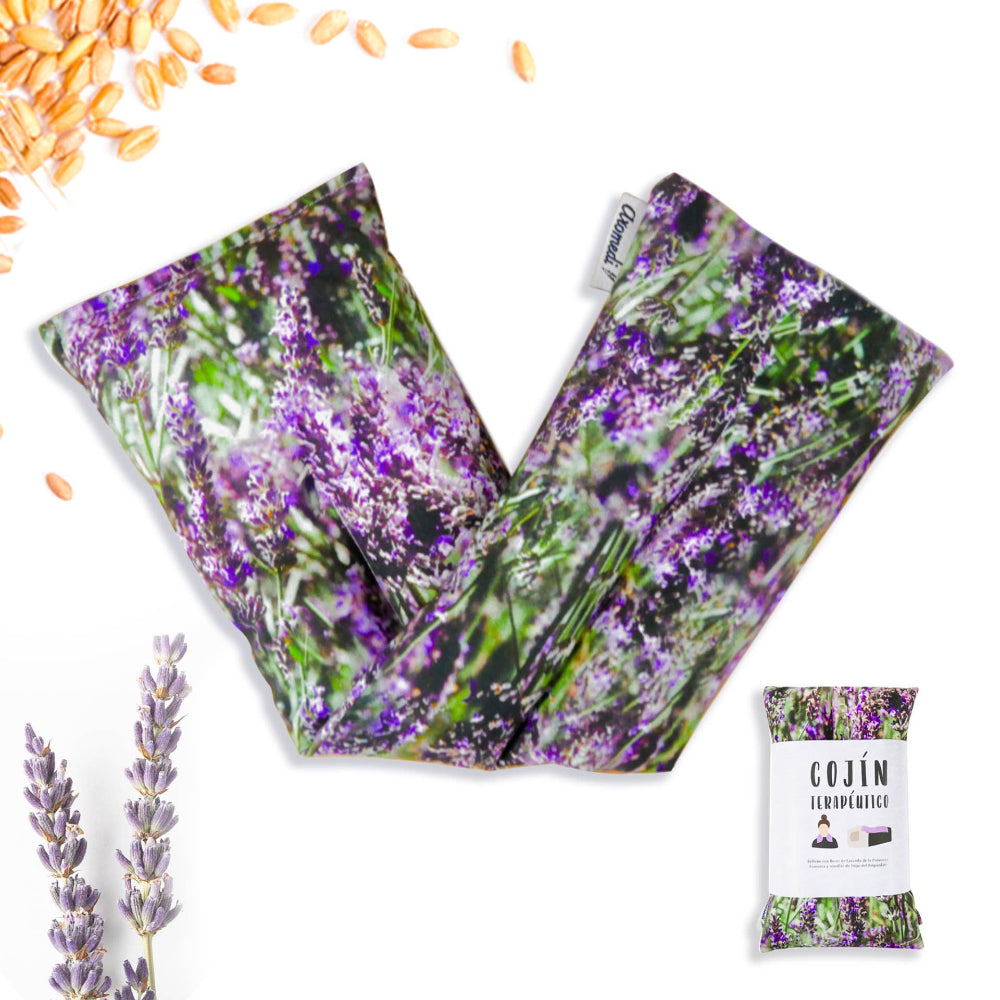 A pair of therapeutic pillows with a printed design featuring purple flowers and lavender, along with individual packaging shown in the foreground.