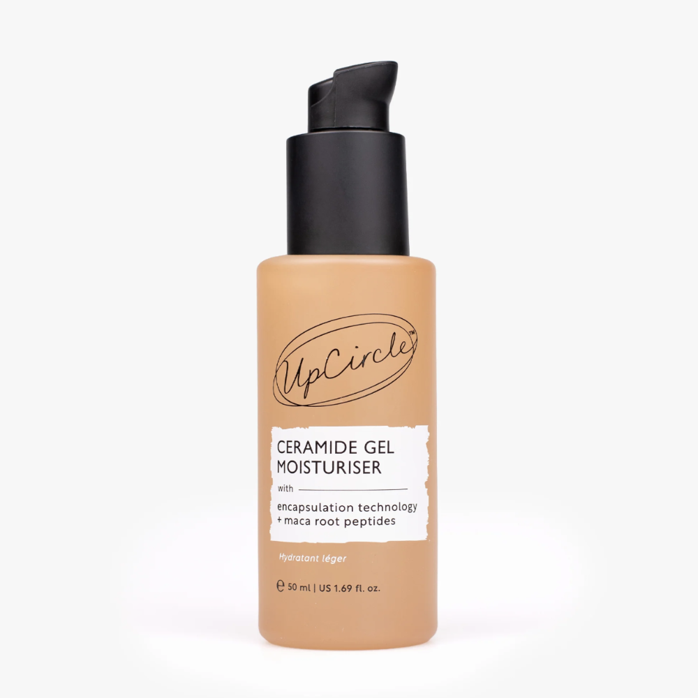 A bottle of UpCircle Ceramide Gel Moisturiser with a black pump dispenser and a beige bottle body, shown on a clean white background.