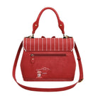 Red handbag with a decorative patch on a white background