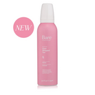 A pink aerosol can of Bare by Vogue Clear Whipped Tan with a white cap, shown on a white background with a pink circular 'NEW' badge on the left.