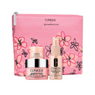 Clinique skincare products with a pink floral pouch on a white background