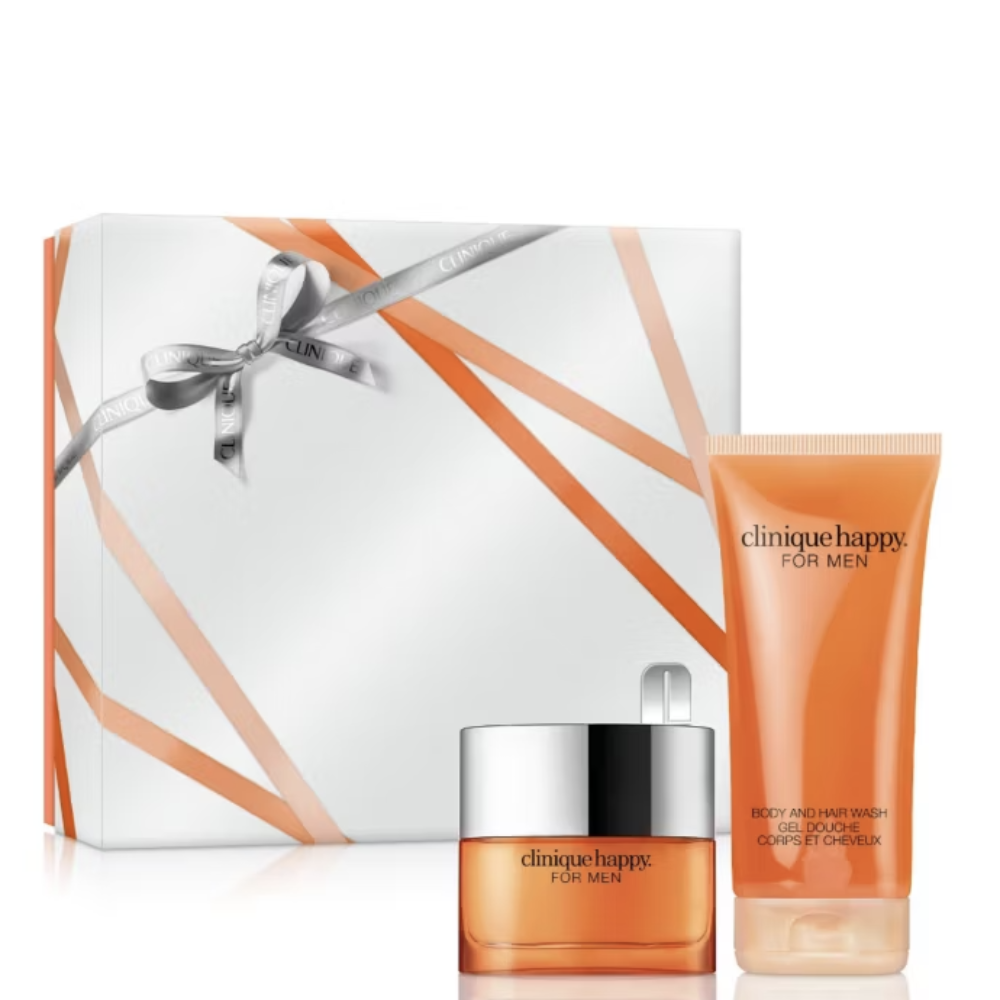 Clinique Happy For Men gift set featuring an orange body and hair wash tube, an orange body perfume with a silver lid, and a white gift box with orange ribbon accents.