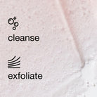 Close-up of a pale pink exfoliating cleanser with visible foam bubbles and black text reading 'cleanse' and 'exfoliate' on a light pink textured surface.