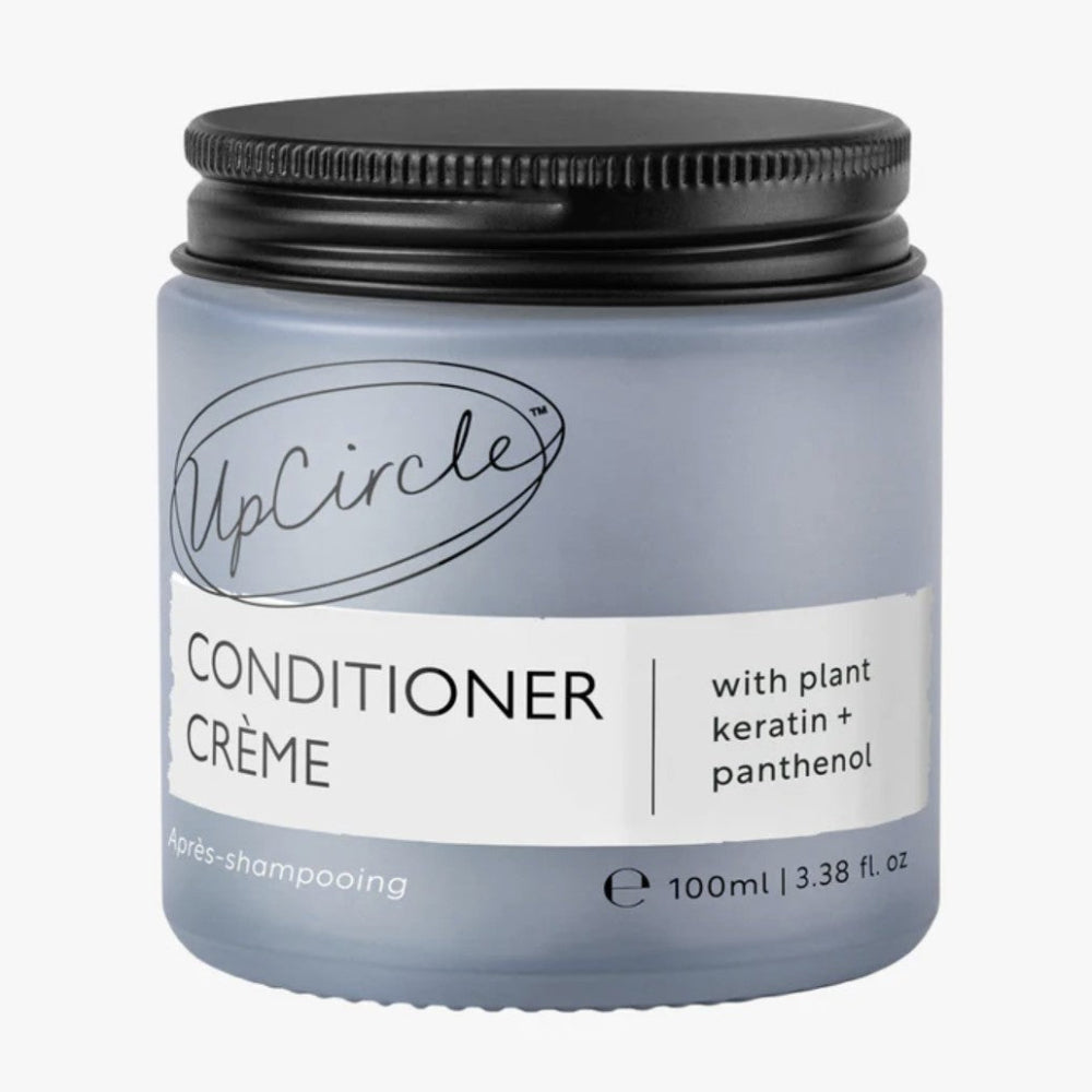 UpCircle Conditioner Crème jar with black lid on a white background