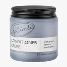 UpCircle Conditioner Crème jar with black lid on a white background