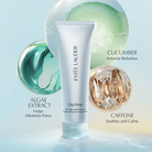 Estée Lauder DayWear Glow Boost Jelly Cleanser tube centred on a pale blue background with decorative translucent spheres and marketing text reading 'Algae Extract,' 'Cucumber Instantly Refreshes,' and 'Caffeine Soothes and Calms.'.
