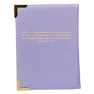 Purple notebook with gold text on a white background