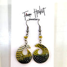 Pair of earrings with black, yellow, and white design on a white background with 'Fiona Herbst Jewellery' branding.