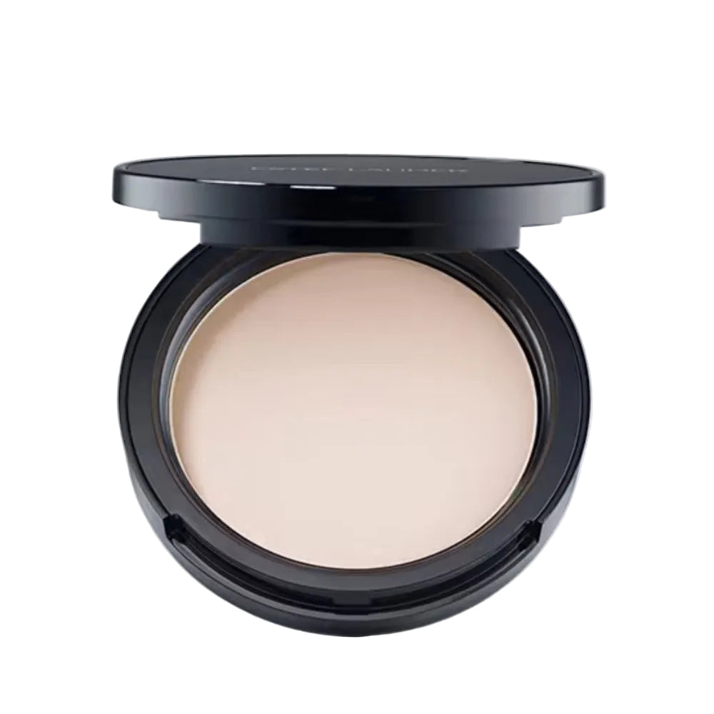 Compact powder in a black case on a light gray background