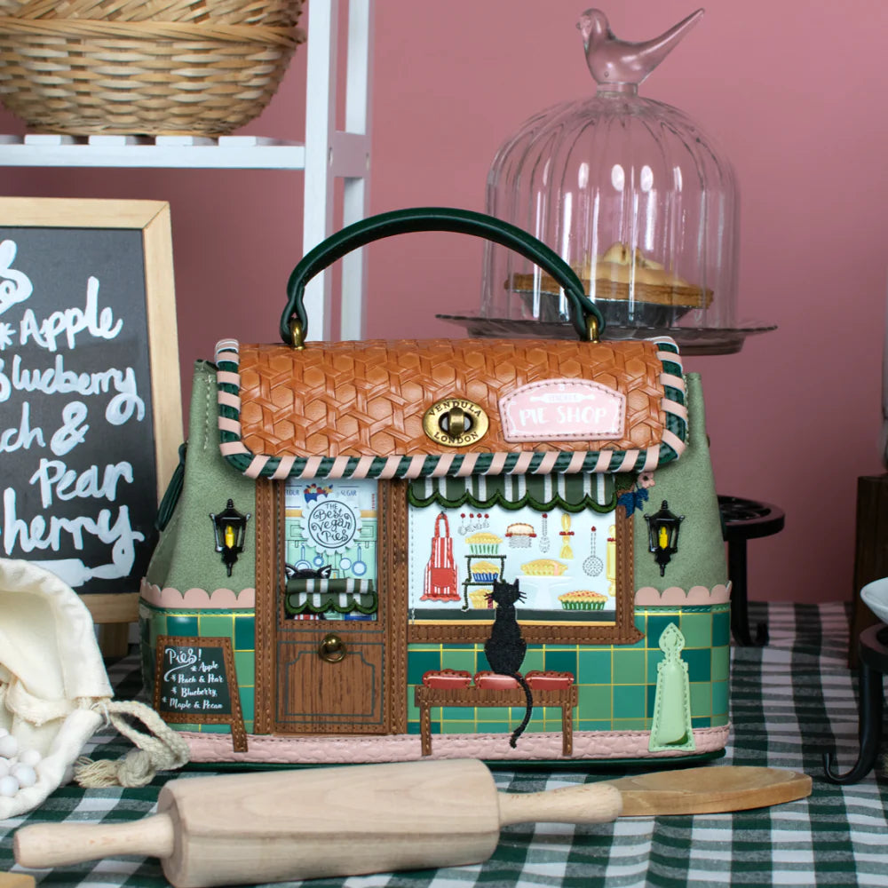 Decorative toy shop with a cat on a checkered tablecloth