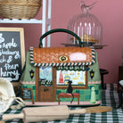 Decorative toy shop with a cat on a checkered tablecloth