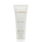 A white squeeze tube of Estée Lauder Glimmer Body Lotion with gold lettering, centered on a clean white background.