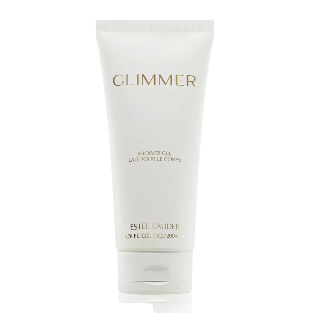 A white squeeze tube of Estée Lauder Glimmer Shower Gel with gold lettering, centered on a clean white background.