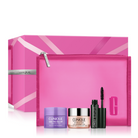 Clinique gift set featuring a pink zippered pouch, a large pink presentation box, a purple cleansing balm, a pink-and-silver Ultra-High-End cream jar, and a black mascara tube on a white background.