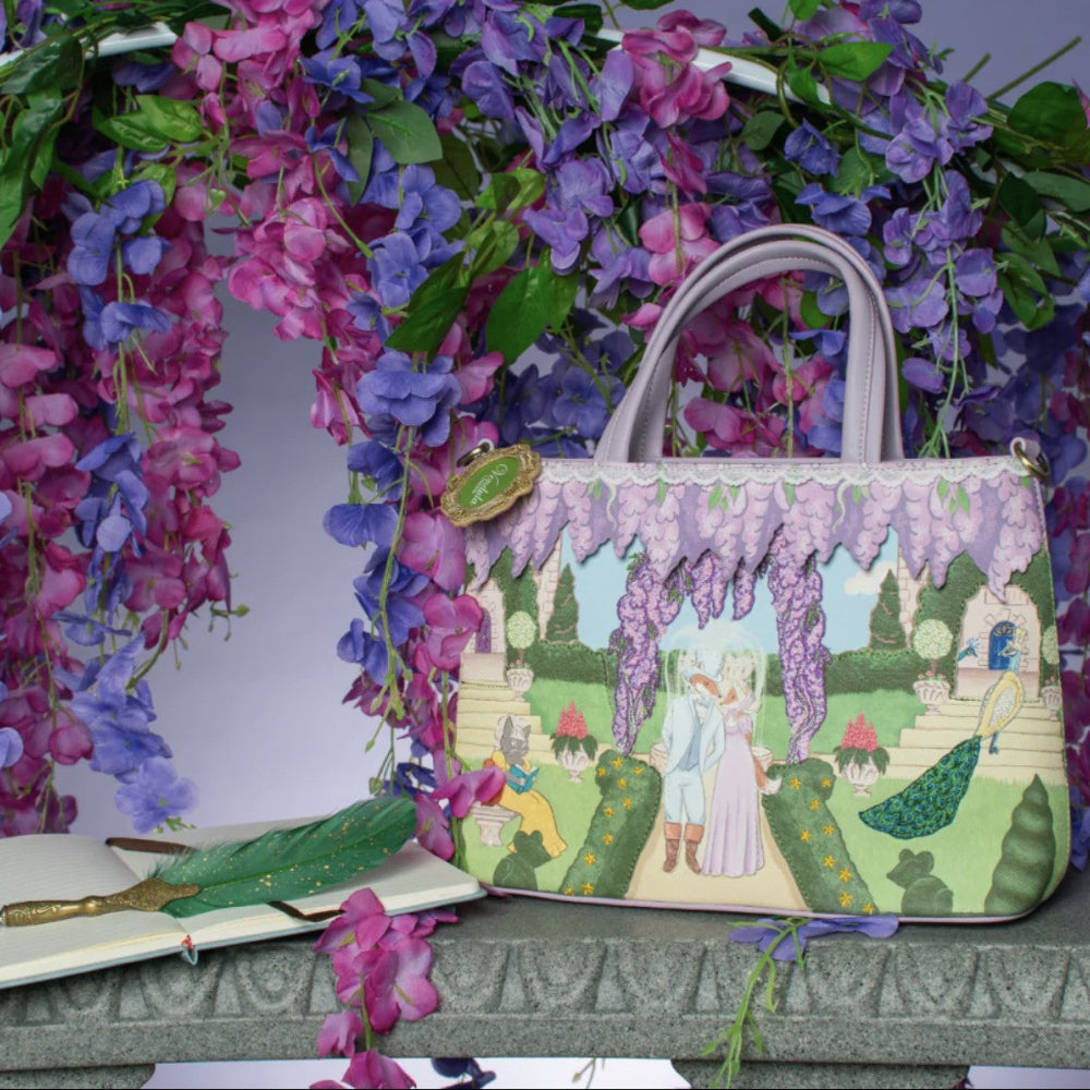 Handbag with garden scene design surrounded by flowers