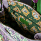 Green bag with animated character pattern, featuring a visible Vendula logo.