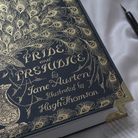Book-shaped handbag with 'Pride and Prejudice' design on a white background