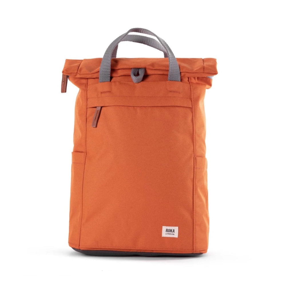 Orange backpack with gray handle on a white background