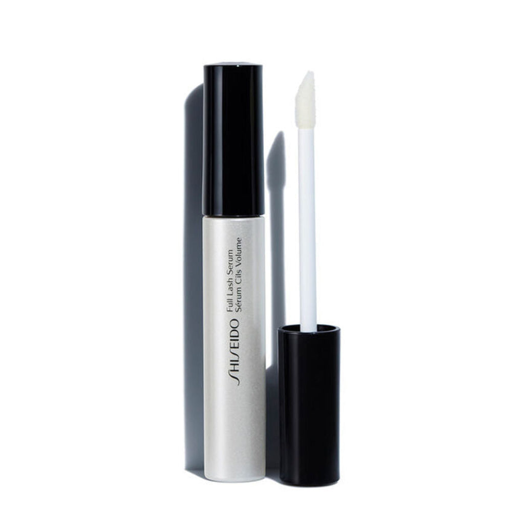 Shiseido lash growth serum with applicator on a white background