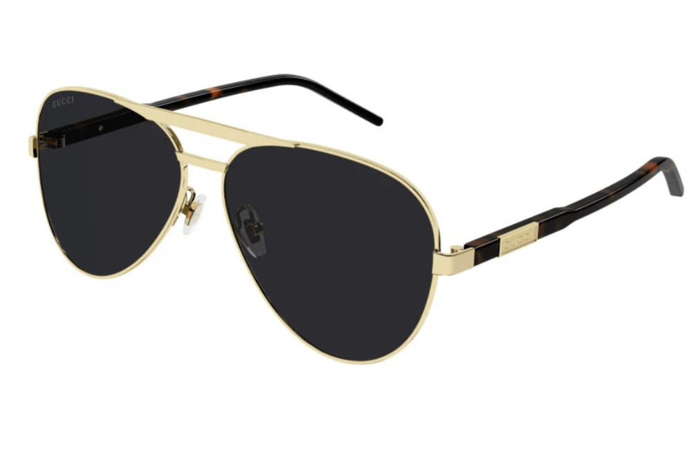 Gold-framed sunglasses with black lenses on a white background