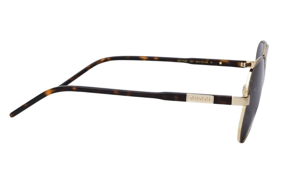 Sunglasses with tortoiseshell frame and black lens on a white background