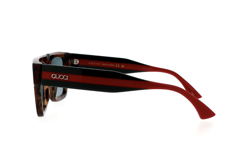 Sunglasses with a black and red frame on a white background