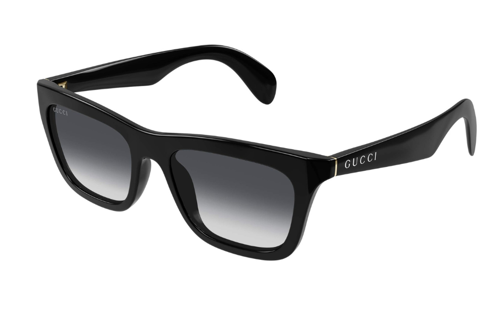 Black Gucci sunglasses with gradient lenses on a white background