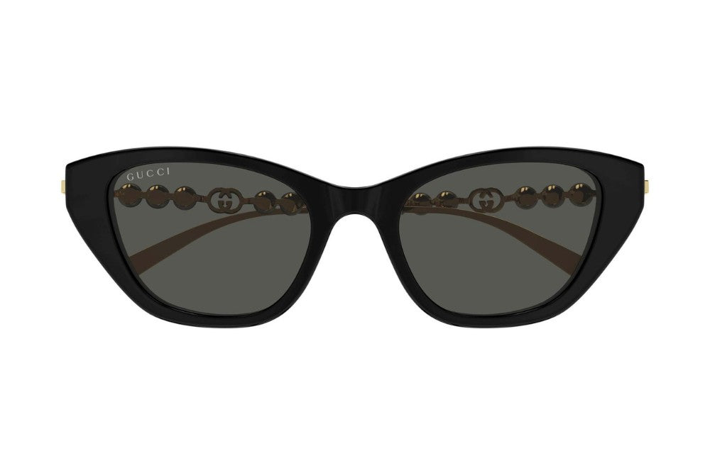 Black cat-eye sunglasses with decorative elements on a white background