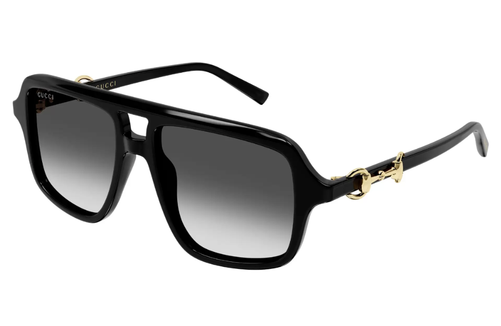 Black sunglasses with gold accents on a white background