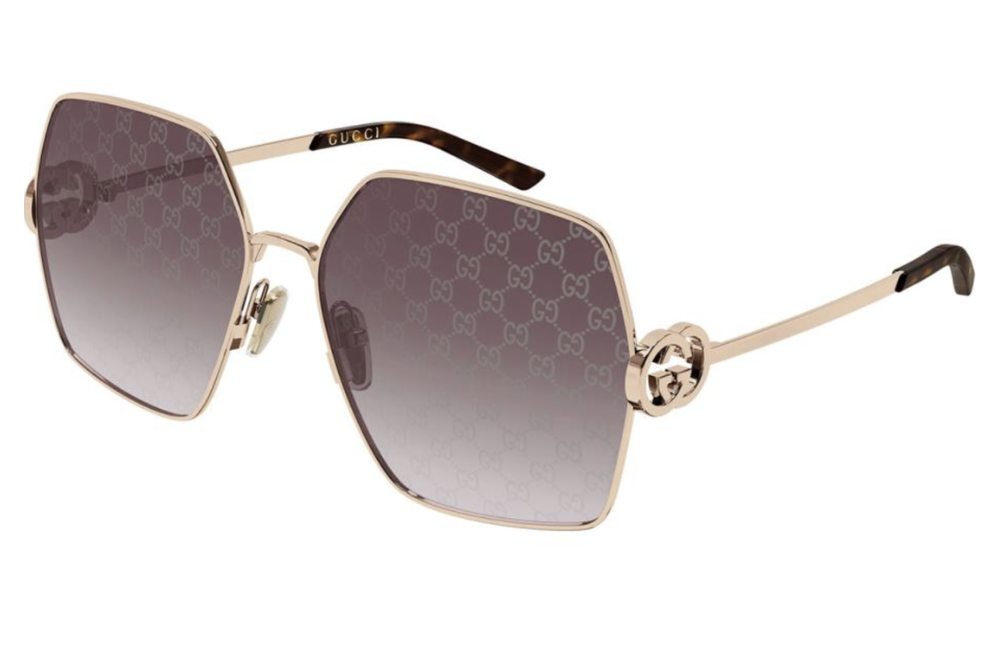 Gold sunglasses with a brand logo on a white background