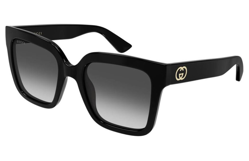 Gucci GG2190S square sunglasses with a glossy black acetate frame, gradient gray lenses, and a gold interlocking G logo on the temple.