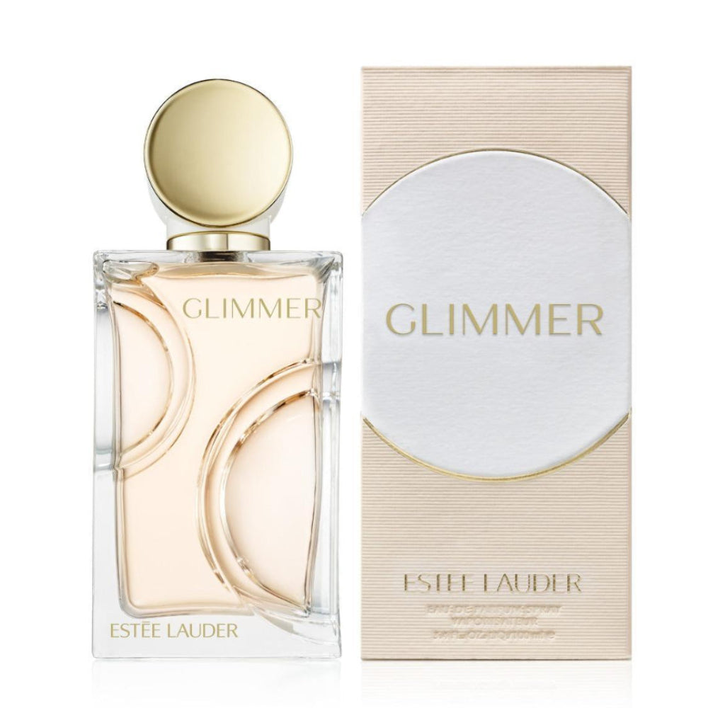 Estee Lauder Glimmer Eau de Parfum bottle with a gold cap next to its textured beige and white packaging box